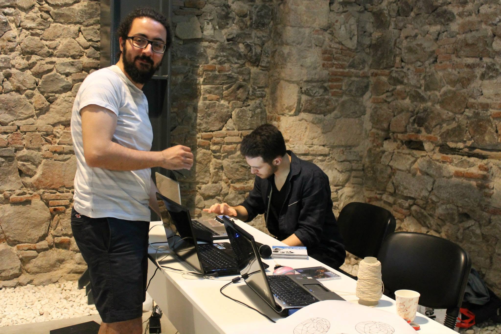 Two organizers reviewing plans on laptops
